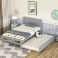 Cama individual de madera gris con cama nido
