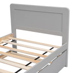 Cama individual de madera gris con cama nido